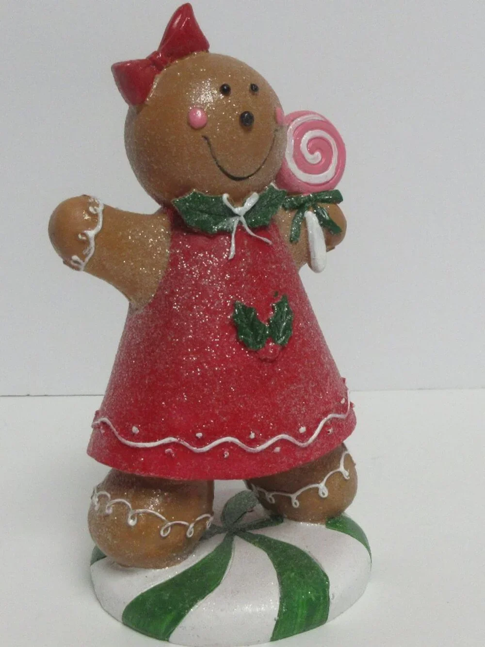 Festive Gingerbread Girl Figurine Holding Pink Lollipop